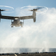 Illustration for article titled USS iNew Orleans/i Returns To Port With MV-22 Osprey Hanging Precariously Off Its Deck
